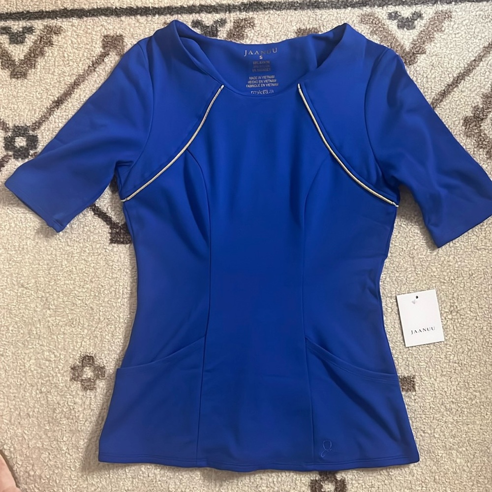 Brand new royal blue size small JAANUU peplum scrub top
